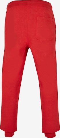 Tapered Pantaloni di Urban Classics in rosso