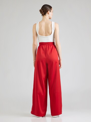 ADIDAS ORIGINALS - Pierna ancha Pantalón 'Adicolor' en rojo