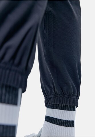 Born Living Yoga Tapered Weatherproof pants 'Minho' in Black