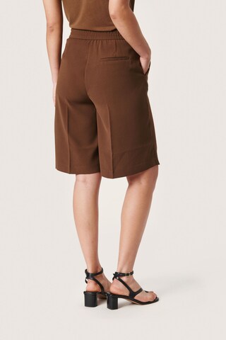 SOAKED IN LUXURY Loose fit Trousers with creases 'Bruna' in Brown