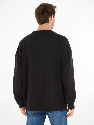 Calvin KleinSweater majica - crna boja: stražnji dio