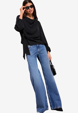 Friends Like These Blus i svart: framsida