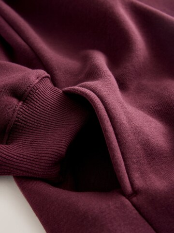 Sweat-shirt self. en rouge