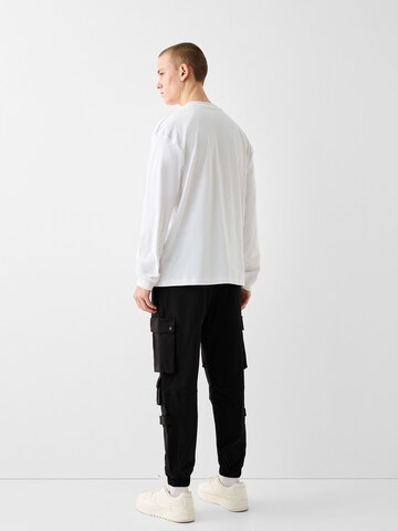 Bershka Tapered Cargo nadrágok - fekete