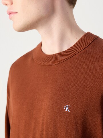 Pull-over Calvin Klein Jeans en rouge