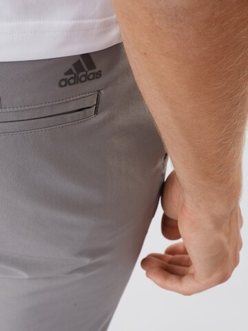 ADIDAS GOLF Slimfit Sportovní kalhoty – šedá