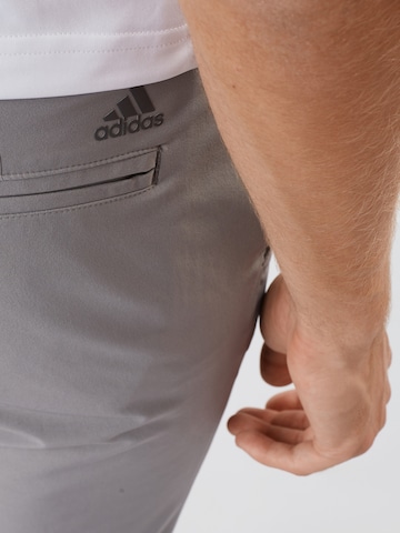 Slimfit Pantaloni sportivi di ADIDAS GOLF in grigio