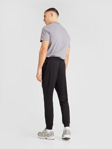 PUMA Tapered Sports trousers in Black
