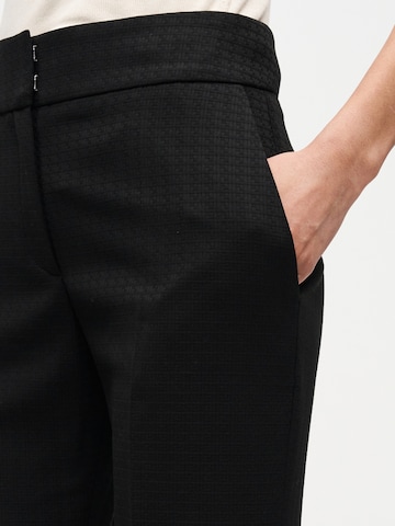 HUGO - Acampanado Pantalón de pinzas 'Hovania' en negro