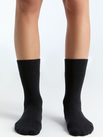 Albero Natur Socken 'Bio-Baumwoll-Frotteesocken Unisex – 4er Pack'‌‌‌‌‌‌‌‌‌ in Schwarz: Vorderseite