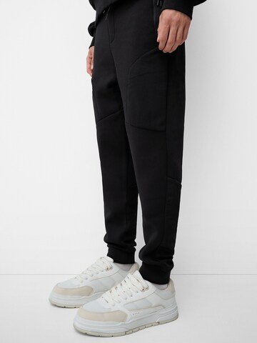 Bershka Tapered Bukser i sort
