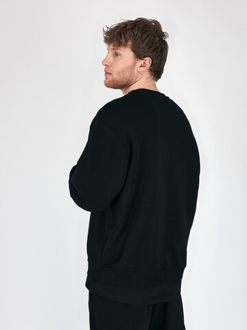 Magdeburg Los Angeles Sweatshirt 'ESSENTIAL' in Schwarz: zadná strana