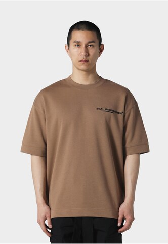 Irasuto Studios T-shirt 'Kao' i brun: framsida