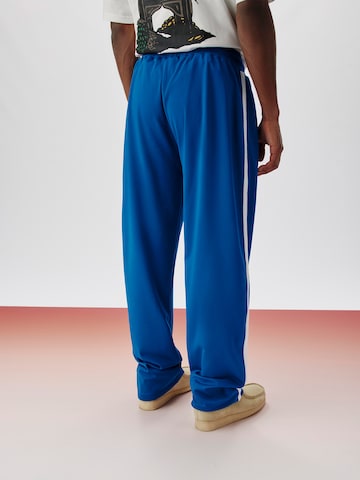 ABOUT YOU x Kingsley Coman Regular Trousers 'Kian' in Blue