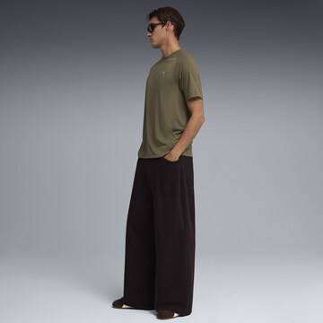 PUMA T-Shirt 'Evostripe' in Grün