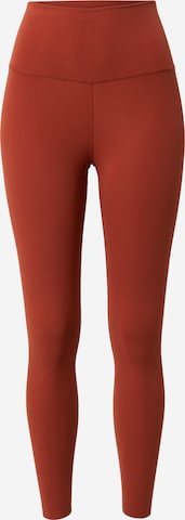 NIKE Skinny Sportbroek in Oranje: voorkant