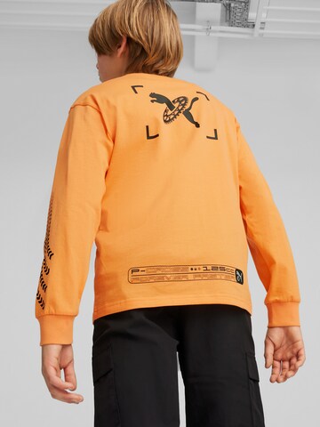 PUMA T-shirt 'CLASSICS XCOUNTRY BIKER' i orange