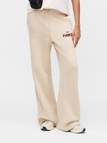 Nike Sportswear Wide leg Trousers 'CLS+ FLC' in Beige: front
