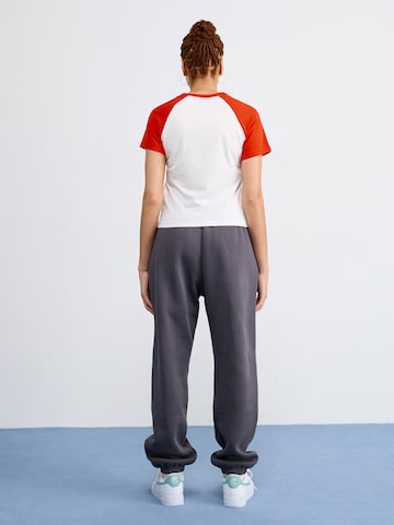 Nike Sportswear Tapered Trousers 'Phoenix' in Grey
