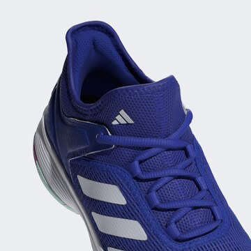 Chaussure de sport 'Ubersonic 4' ADIDAS PERFORMANCE en bleu