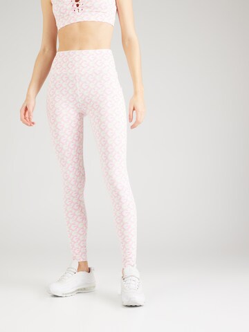 Skinny Pantaloni sportivi 'LOGOMANIA' di GUESS in rosa: frontale