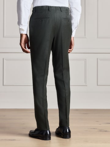 Slimfit Pantaloni con piega frontale di Next in verde