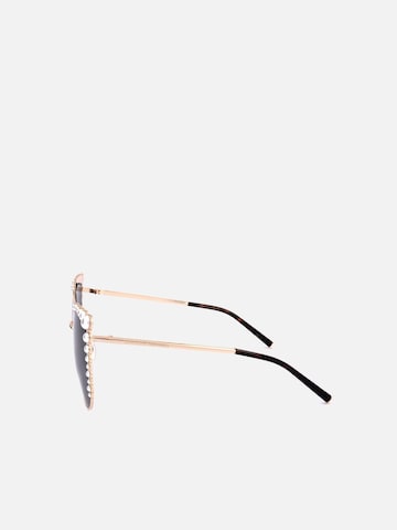Carolina Herrera Sunglasses in Gold