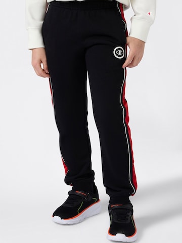 melns Champion Authentic Athletic Apparel Pakapēniski sašaurināts piegriezums Bikses: no priekšpuses