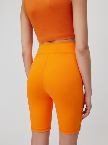 Skinny Pantaloni sportivi 'Anian' di LeGer by Lena Gercke in arancione