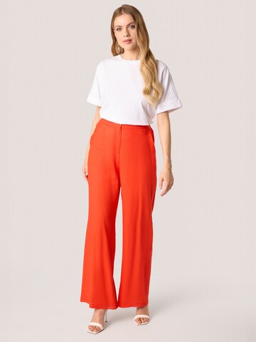 Loosefit Pantaloni di Quiosque in arancione