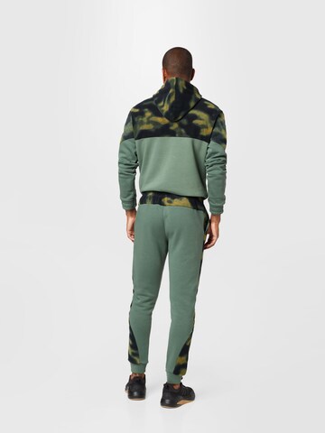 ADIDAS SPORTSWEAR Tapered Sportbroek 'Polar Fleece Nature Print' in Groen