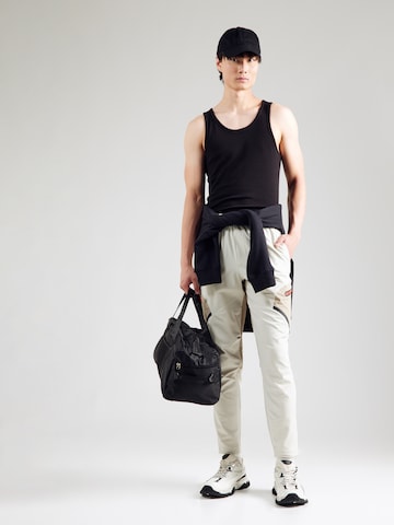 Regular Pantaloni sport 'Unstoppable' de la UNDER ARMOUR pe alb