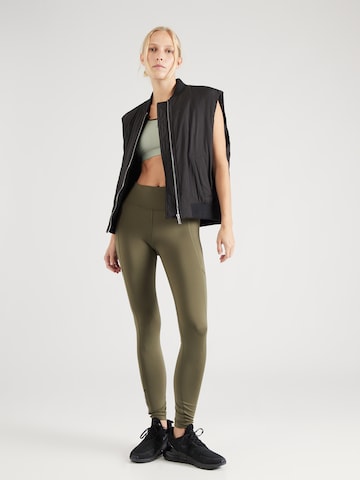 UNDER ARMOUR Skinny Športne hlače 'Fly Fast 3.0' | zelena barva