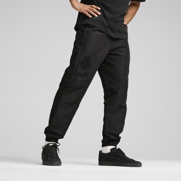 PUMA Tapered Sportbroek in Zwart: voorkant