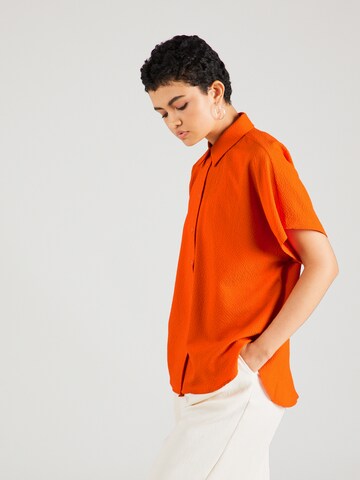 Koton - Blusa em laranja: frente