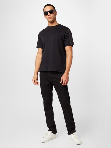 Calvin Klein قميص بلون أسود