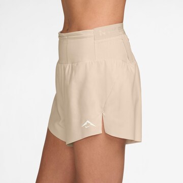 NIKE Regular Athletic Pants 'Trail DF' in Beige