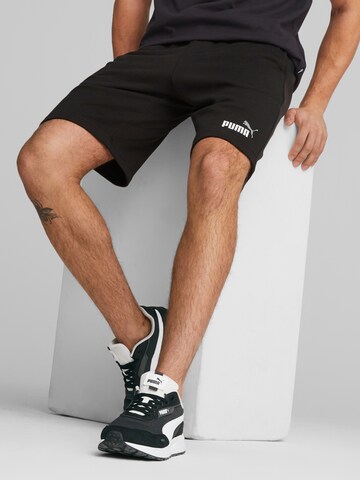 PUMA Regular Workout Pants in Black: front