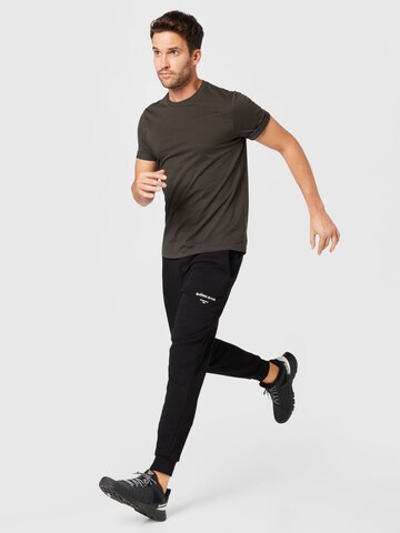 BJÖRN BORG Tapered Sports trousers in Black