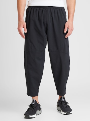 Regular Pantalon de sport 'Unstoppable Airvent' UNDER ARMOUR en noir : devant