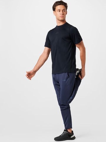 Tapered Pantaloni sport 'Legacy Poly' de la Hummel pe albastru