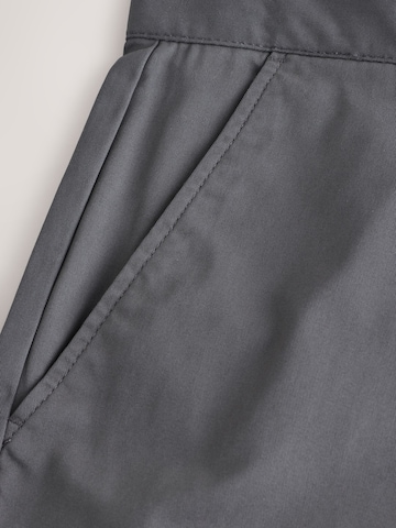 Slimfit Pantaloni chino di Next in grigio