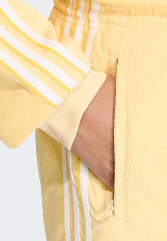 ADIDAS ORIGINALS Loose fit Pants 'Firebird' in Yellow