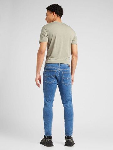 mėlyna Tommy Jeans Prigludęs Džinsai 'AUSTIN SLIM TAPERED'