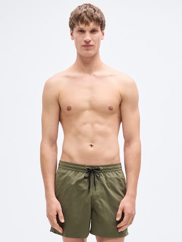 QUIKSILVER Regular Board Shorts 'SOLID 15' in Green: front