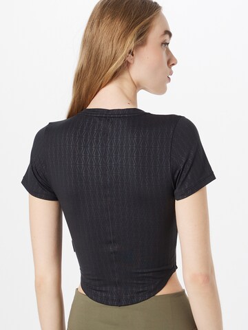 NIKE Functioneel shirt 'One Luxe' in Zwart