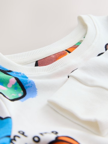 Pijamale 'Loros' de la Next pe bej