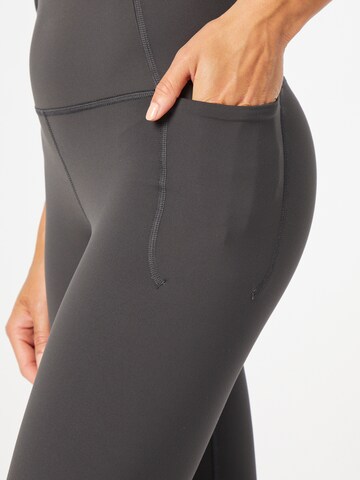 Skinny Pantaloni sportivi 'Meridian' di UNDER ARMOUR in grigio