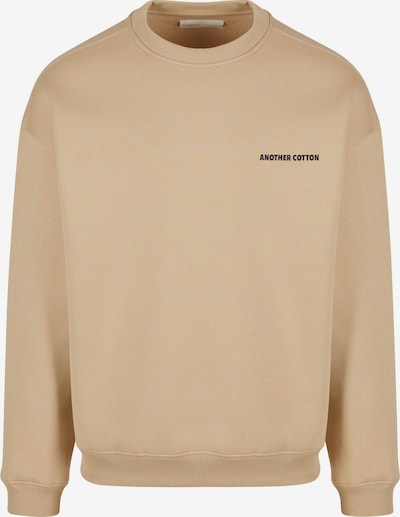 Megztinis be užsegimo iš Another Cotton Lab, spalva – tamsi smėlio / juoda, Prekių apžvalga