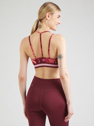 Bustino Reggiseno sportivo di PUMA in rosso